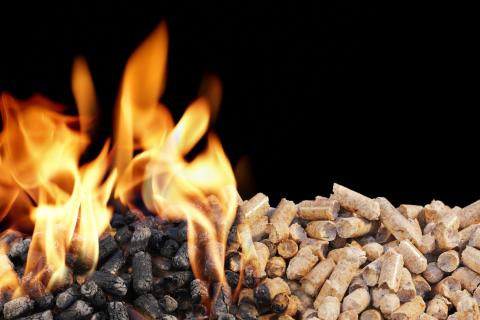 Burning wood pellets